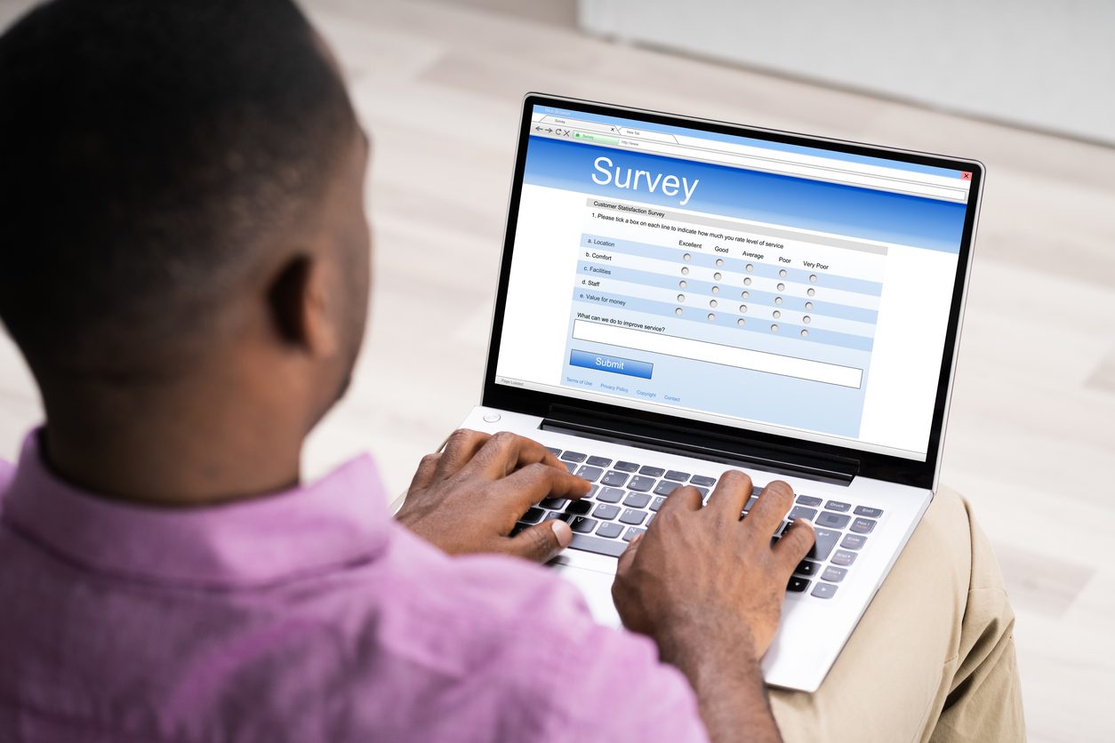 Man taking giving customer feedback with a survey