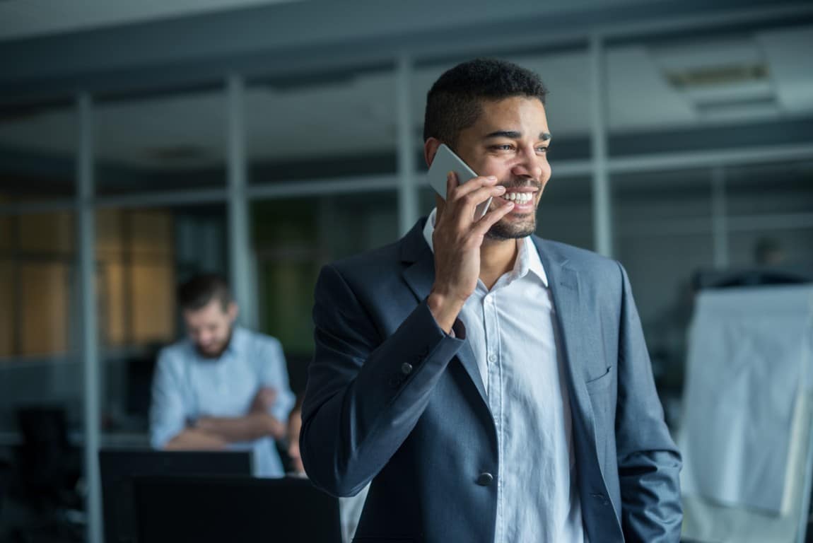 Happy man talking on the phone.