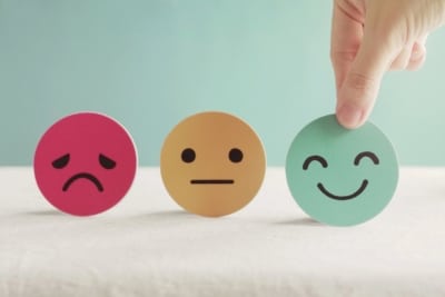faces representing customer satisfaction