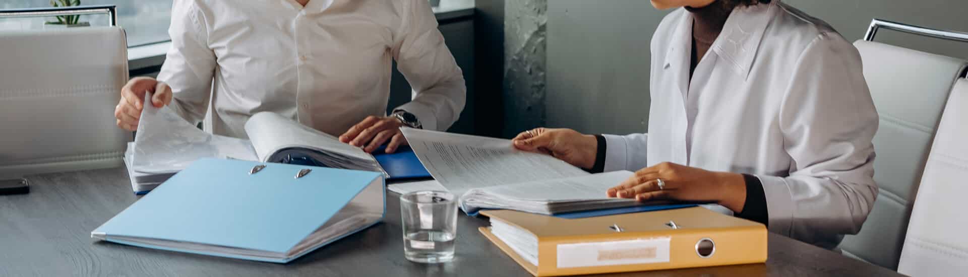 people sitting at a table discussing the insurance bpo guide