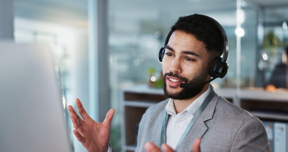 A contact center agent makes an outbound call to a promising lead. A contact center agent makes an outbound call to a promising lead.