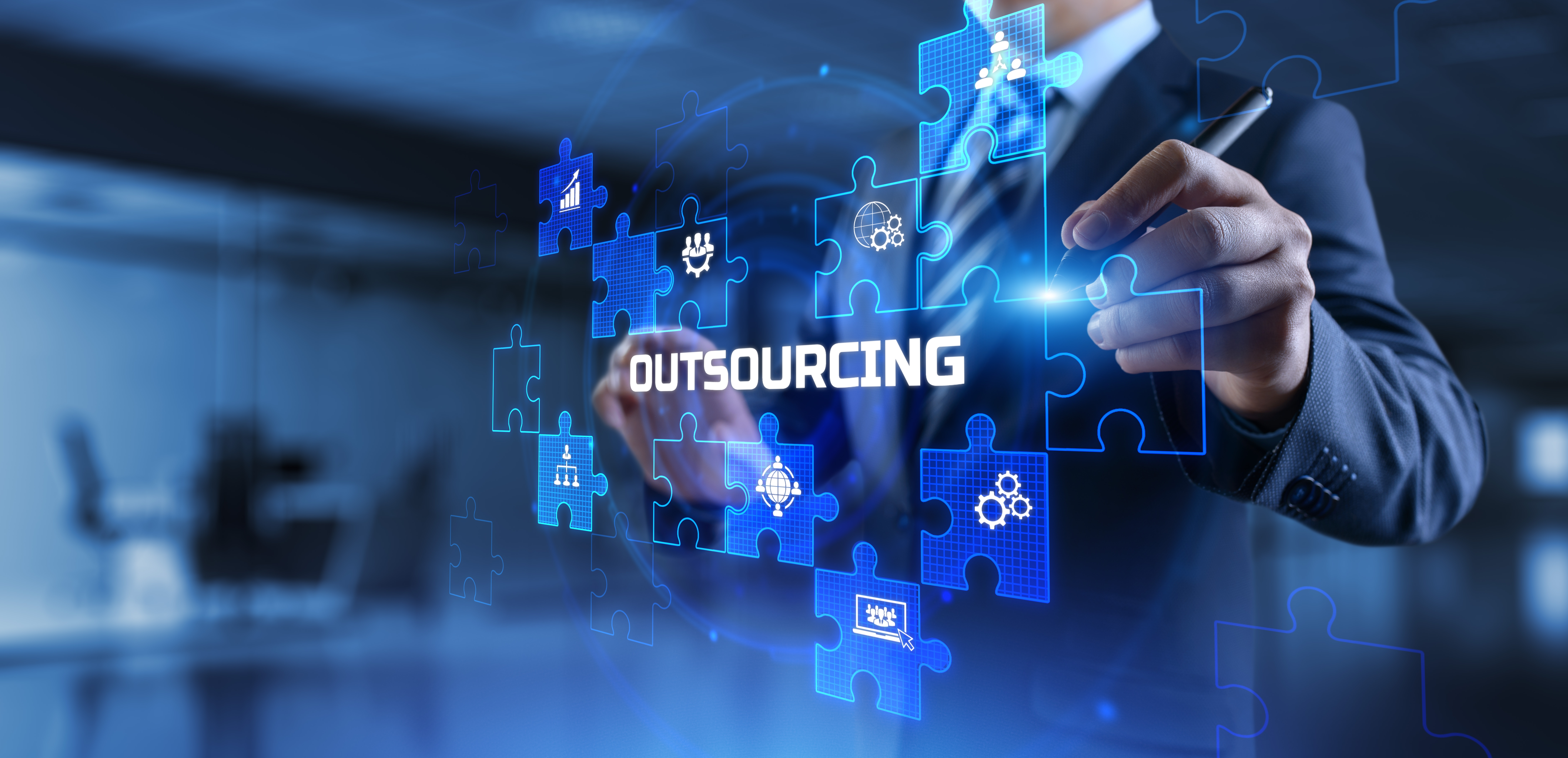 Outsourcing,Global,Recruitment,Human,Resources,Management,Concept. the word outsourcing as part of a digital screen of puzzle pieces, showing how it connects all the pieces.