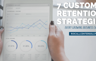 Employee looking at charts and data of customer retention for a business