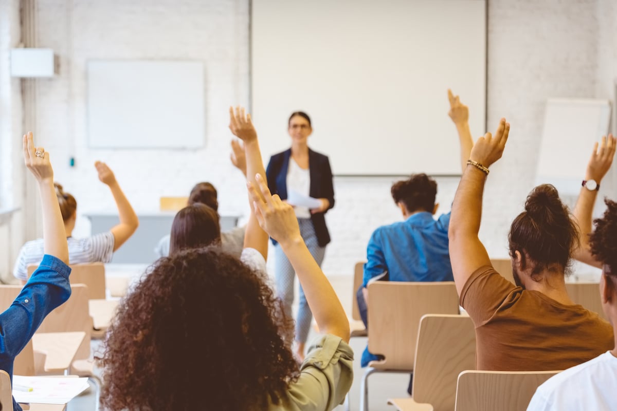 students in a classroom who would benefit from a higher education call center