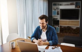 someone at their computer developing a clienteling strategy