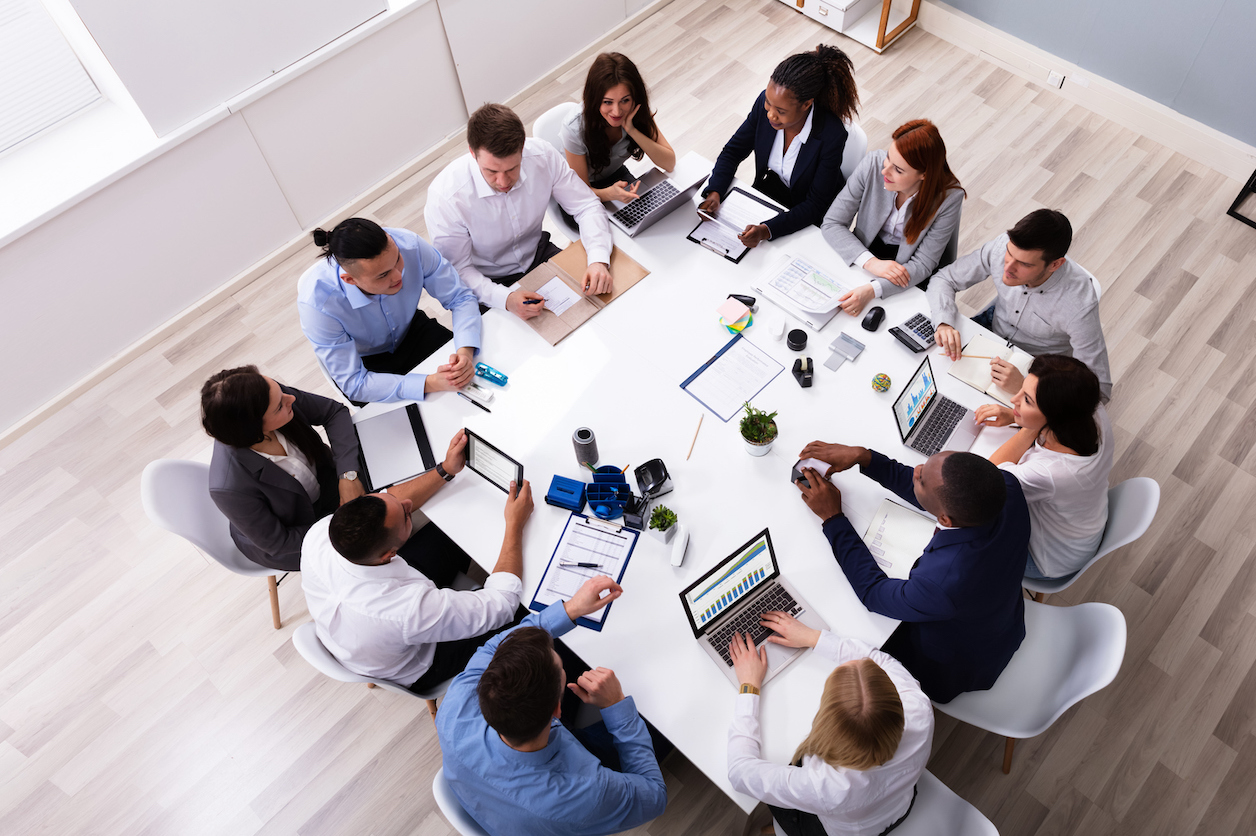 a bpo outsourcing team hard at work in a conference room