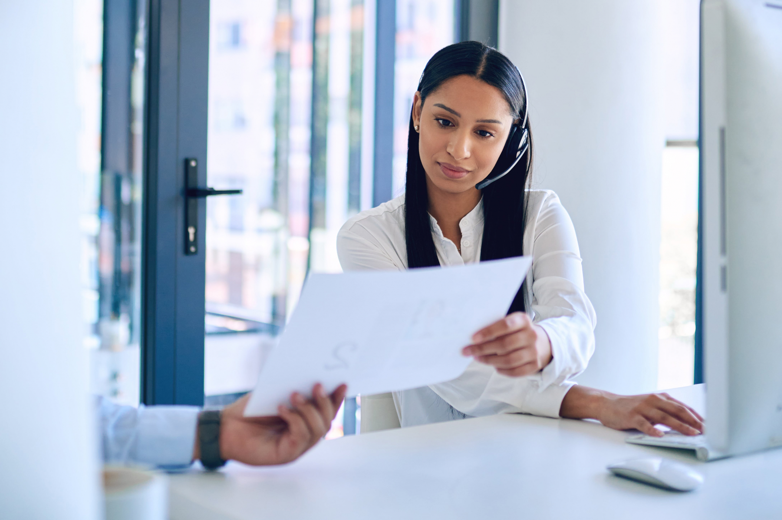 Call center agent reviewing a call script.