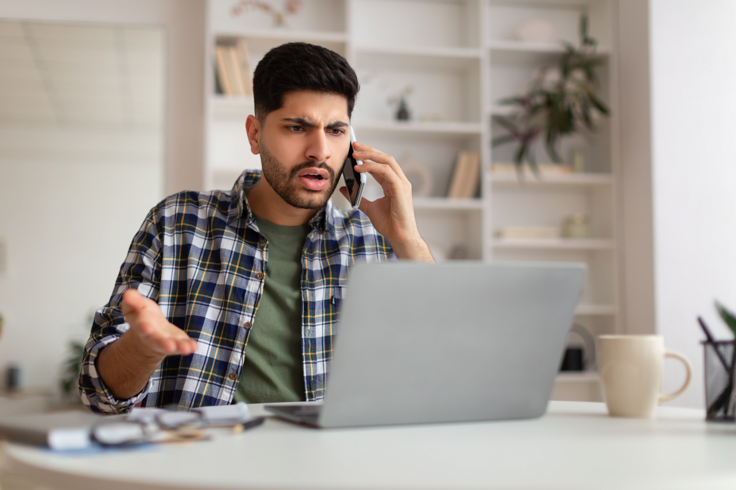 Angry customer on the phone with a customer service representative